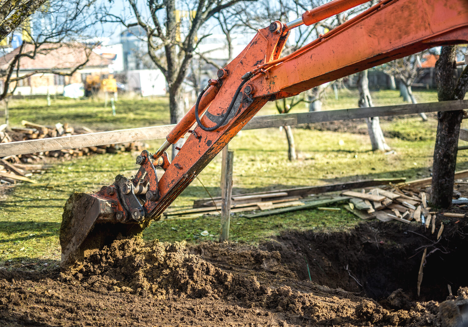 Track-type loader excavator machinery doing earthmoving and leveling at earth quarry