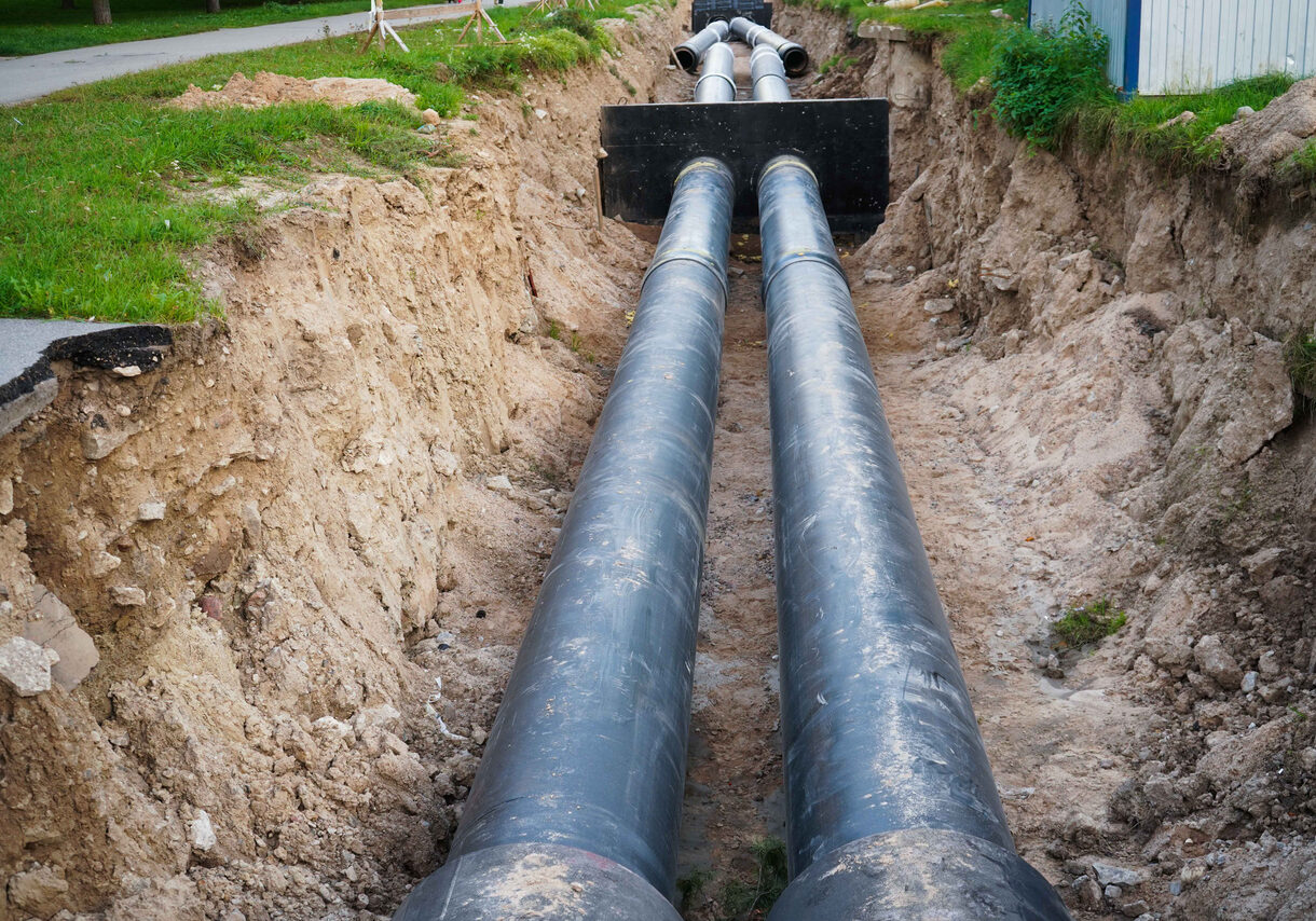 Installation of the distribution unit of heating and water supply network. Frame for connecting pipes in the trench of ground